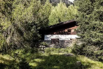 Image de Chalet \"Am Reschensee\" avec vue sur le lac, terrasse privée et jardin privé