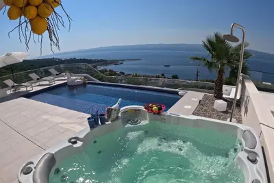 Image de Maison de vacances pour 6 personnes env. 200 qmà Dugi Rat, Dalmatie (Centre de la Dalmatie)