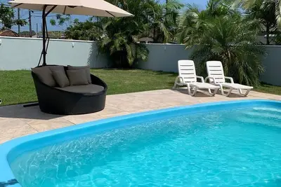 Image de M&M House - Casa com Piscina e Ar Condicionado em Matinhos Para 10 Pessoas
