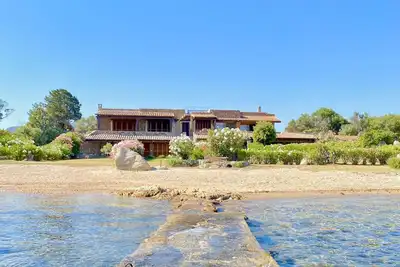 Detached beachfront house with private beach access.