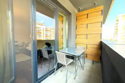 Image de Cozy Corner Apartment: Baby Crib and High Chair