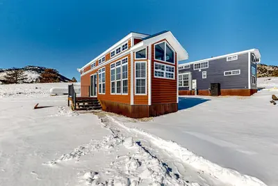 Image de Light-filled cabin on 1, 800-acre working ranch with animals, mountains & games