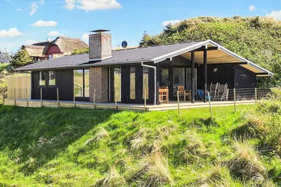 Image de Maison de vacances pour 6 a Blokhus-By Traum