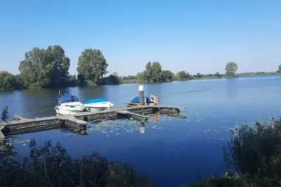 Image de Maison de vacances 'Ferienhaus Zum Eiderweg Hennstedt' avec terrasse et jardin privés