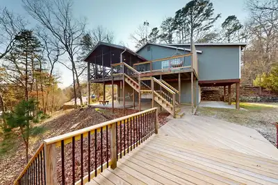 Image de Lakefront retreat with screened sunroom, wood stove, multiple decks, & Ac