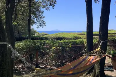 Image de Cala Dei Pirati. \nGarden cottage with sea view on the Tuscan archipelago