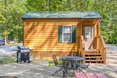 Deluxe Cabin (w/ Bathroom) - Deluxe Cabin (w/ Bathroom) Better than a motel! Enjoy camping in comfort! Kitchen with stove top and full size fridge with dishes pots included. Full bathroom with shower. Cable Tv Dvd player. Gas grill on your own concre