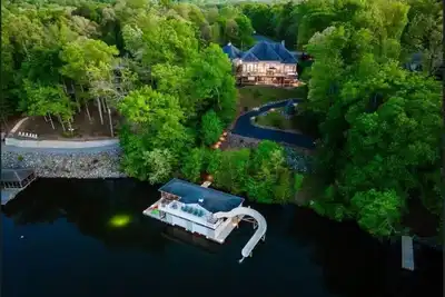 Image de Lakefront Water Slide Sauna Pool Hot Tub Dock