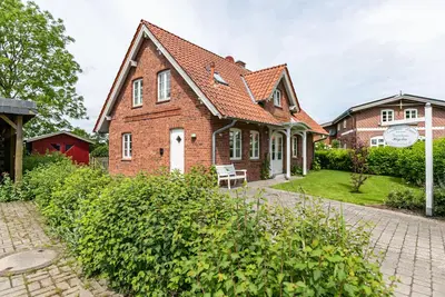 Image de Maison de vacances 'Landhaus Högelia Flensbúrger Förde' avec terrasse privée, jardin privé et Wi-Fi