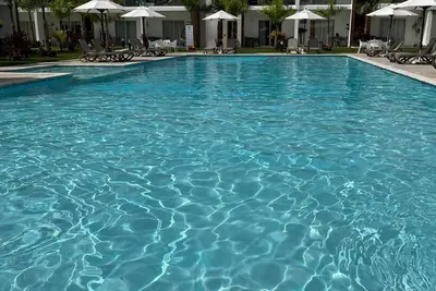 Image de Cozy vacation home away from home. Enjoy the pool from your door step. \n