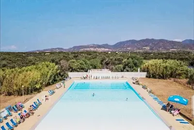 Image de Confortable appartement avec piscine, Wifi, climatisation, Tv, terrasse et animaux admis