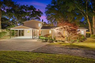 A charming 4-bedroom waterfront with a private dock retreat that offers a secluded serene getaway!