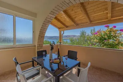 Image de Apartment directly at the beach, shared terrace on the beach with grill
