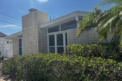 Private Golden Beach access for this Mid-Century Modern Home