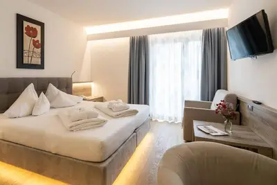Image de Doppelzimmer Linde mit Balkon 22 m² - Familienhotel Post-kinder&sport am Millstätter See