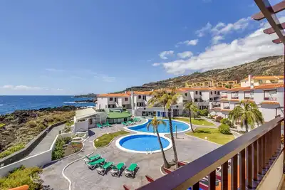Image de Propriété de vacances Isla Bonita- C - 84' avec vue sur la mer, piscine partagée et Wi-Fi