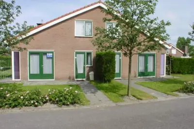 The type Strandparel  located at the Schoneveld holiday park  is a cosy semi-detached house with garden and terrace. There is a spacious living room with an open kitchen and a cosy fireplace.