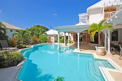 Image de Caribbean villa with award winning pool amidst tropical garden