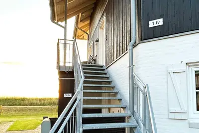 Image de Maison de vacances pour 8 a Bogense-By Traum