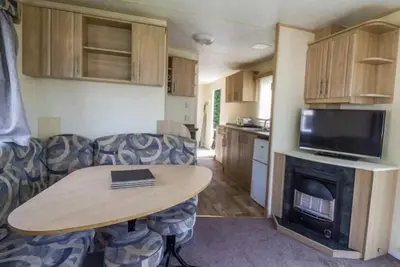 Image de CaravanSleeps8-FirePlace-PetsOk-Golf-Gym-Pool