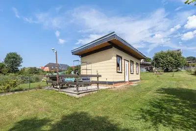 Image de Bungalow 'Ferienhaus Sonne' avec terrasse privée, jardin partagé et Wi-Fi