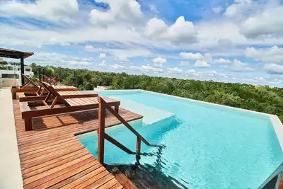 Image de Tulum Retreat: 2-Br Apartment, Rooftop Pool, Modern Comforts