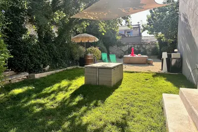 Image de La Maison de la fontaine - Jardin et jacuzzi