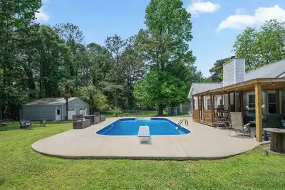 Race Day Retreat: Poolside Haven Near Nascar Track