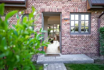Image de Sky & Sand - Moderne Ferienunterkunft mit Sauna und Terrasse