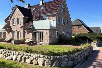 Image de Ferienhaus Kapitän Hus Neubau