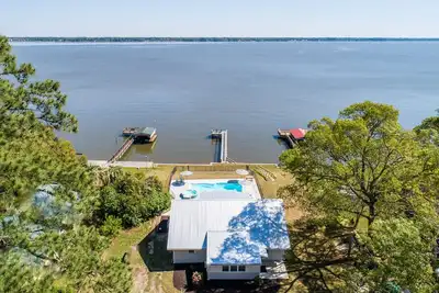 Fully renovated 1959 lake front cottage. In-ground swimming pool and spa.
