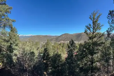 Image de Your little lovers retreat perched above the tall pines.