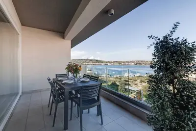 Image de 🌊 Steps from Mellieha Beach! 3Bed/3Bath apartment with terrace & modern comforts 🌴✨ Perfect for families, friends & business stays.