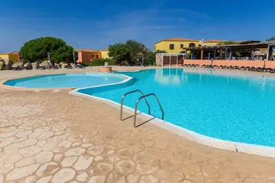 Image de Maison de vacances 'Appartamento Residence Mirice' avec piscine partagée, Wi-Fi et climatisation