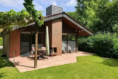 Image de Ferienhaus mit Garten, Südterrasse, Lounge-bereich Sowie Außen- und Innenkamin