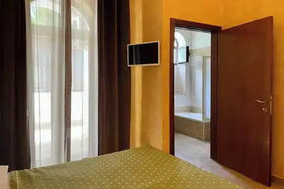 Image de Chambre Lit King-Size de Luxe - Martignani