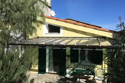 Image de Maison de vacances 'Moderne Casa Camillo dans l’oliveraie' avec vue sur la montagne, terrasse privée et Wi-Fi