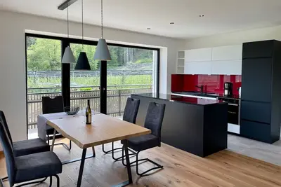 Image de 90 m² new vacation apartment with mountain view, sunny balcony and Wlan.