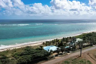 Image de Beach Villa: Watch the Sunrise over the Caribbean Sea\nWalk right onto the Beach