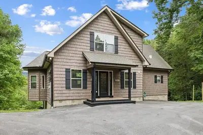 Image de \"Gotcha Covered\" at a Luxurious Secluded 4-bedroom Cabin