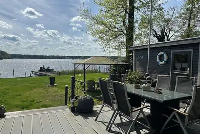Image de Maison de vacances 'Häuser Am See' avec vue sur lac, terrasse privée et Wi-Fi