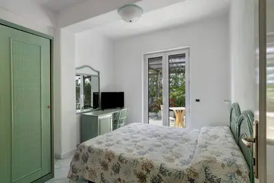 Image de Appartement 'Room B - Vista Giardino' avec jardin partagé, Wi-Fi et climatisation