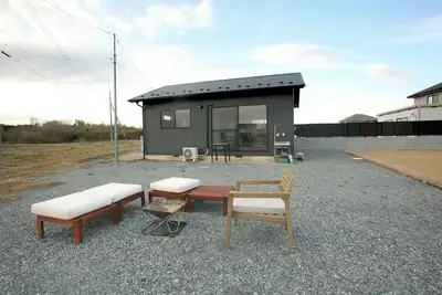 Image de The Camping Yard Higashi Matsuyama\" - Bbq, campfires, and tents available for overnight stays.