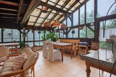 Image de Appartement 'Ferienwohnung Mit Wintergarten' avec terrasse privée, jardin partagé et Wi-Fi