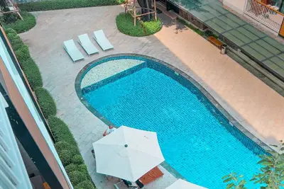 Condominium overlooking the pool next to the sea