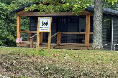 Image de Charming renovated cottage nestled in serene state park.