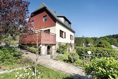 Image de Maison de vacances 'Ferienhaus Pöhlbergblick' avec vue sur les montagnes, terrasse privée et Wi-Fi