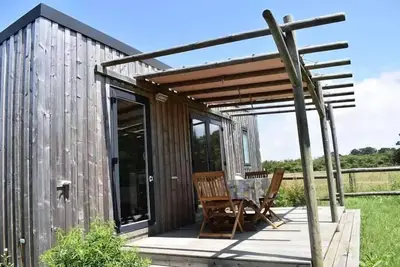 Image de Cottage Premium 28m² (2 chambres) + terrasse couverte + Lv + Tv + Draps + serviettes 4 personnes