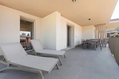 Image de Appartement 'Eleonora C3' avec piscine partagée, terrasse privée et climatisation