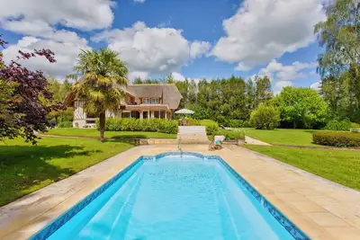 Image de La Chaumière - Tennis & Piscine - Branville